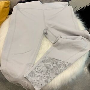 Silvery Fabletics Leggings with floral detail. Looks free people.